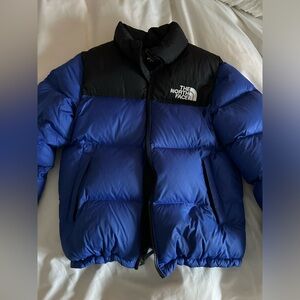 The North Face blue puffer jacket 
Size Youth XL
Will fit women’s S/Men’s S